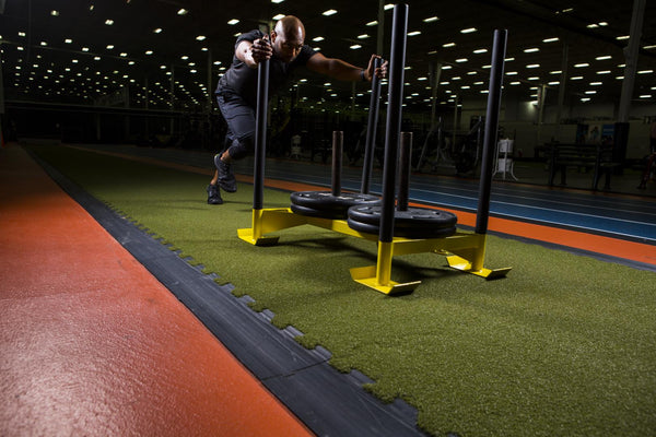 RageTurf Rally Green interlocking tile, installed in a training facility with interlocking edge transition (image: Ecore) | SKU ILT-000014