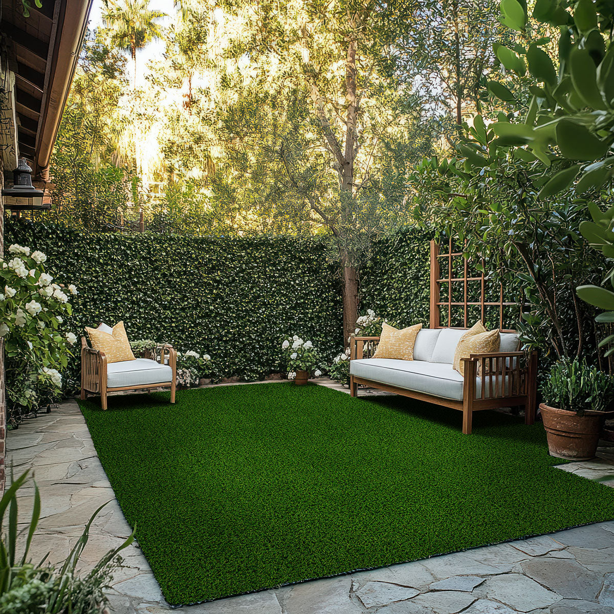 Evergrass Viridian Green Turf 76 oz, installed in a backyard with outdoor seating (image: MSI) | SKU LTRFRVIR15X100-40MM76OZ