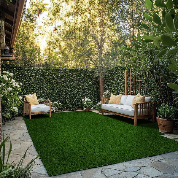 Evergrass Viridian Green Turf 76 oz, installed in a backyard with outdoor seating (image: MSI) | SKU LTRFRVIR15X100-40MM76OZ